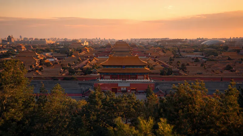Beijing travel guide — the golden rooftops of the Forbidden City at dusk