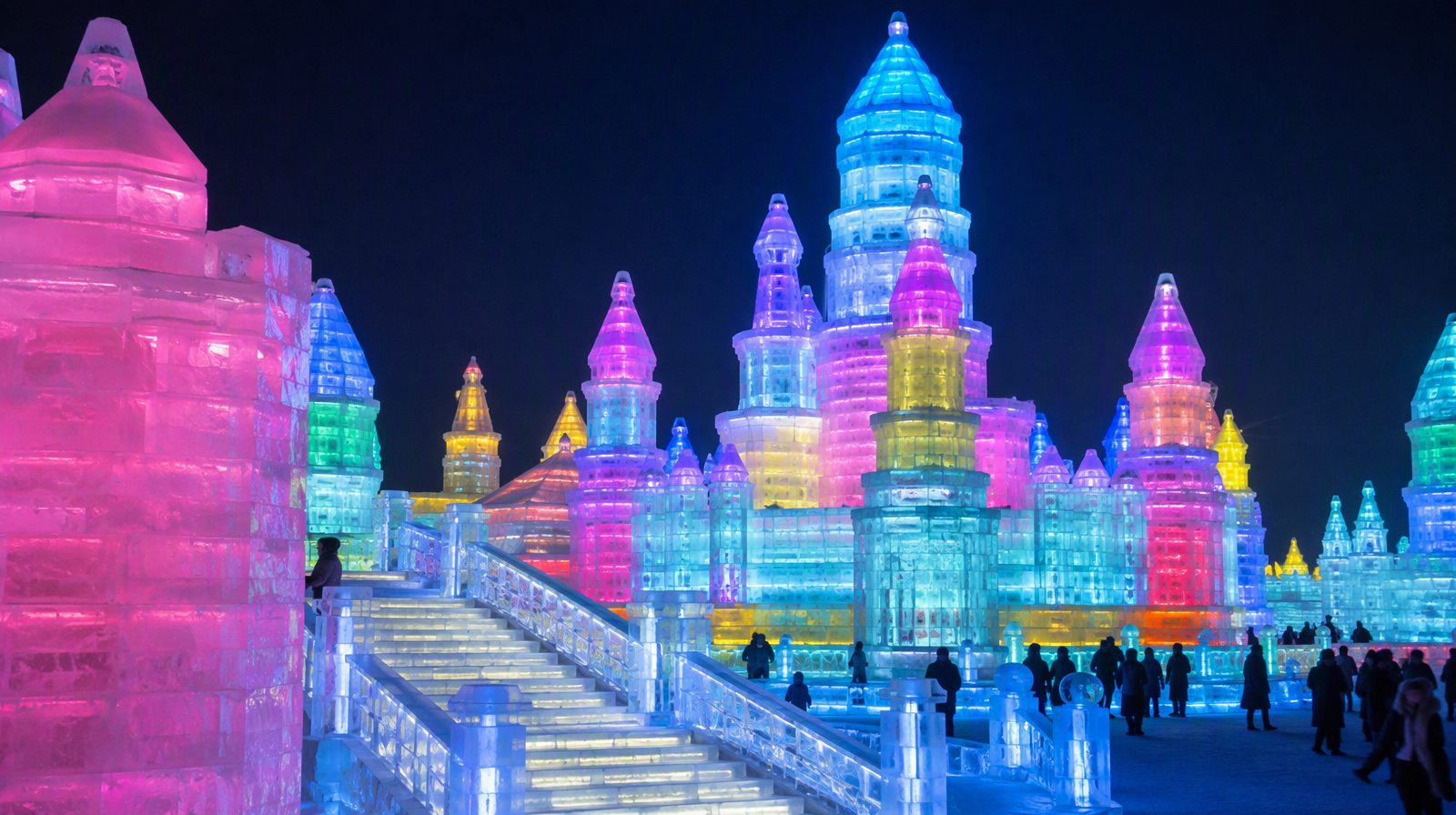 Illuminated ice sculptures at the Harbin Ice Festival at night