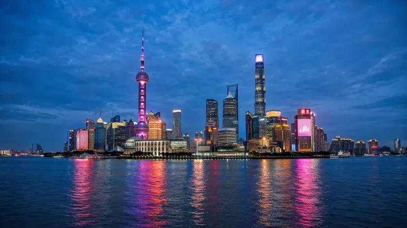 Shanghai travel guide — the Pudong skyline across the Huangpu River at blue hour